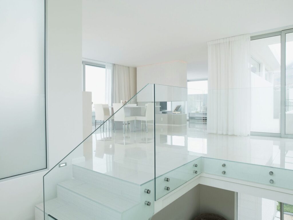 indoor glass railings sun filled room