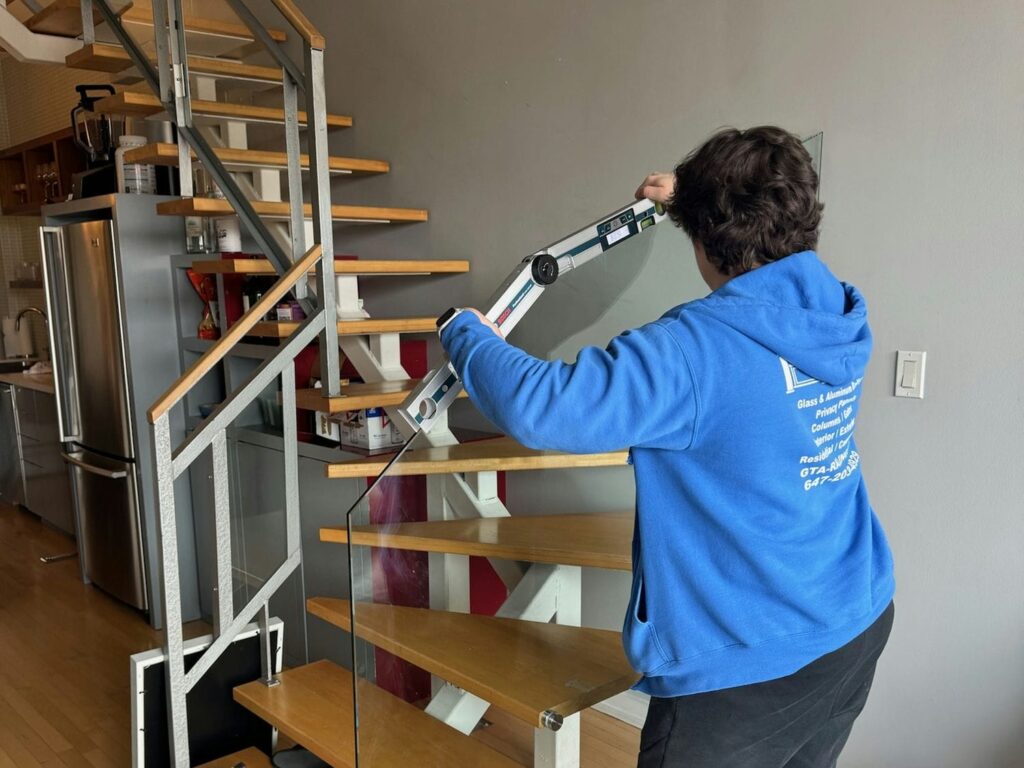gta railings installer measuring railing