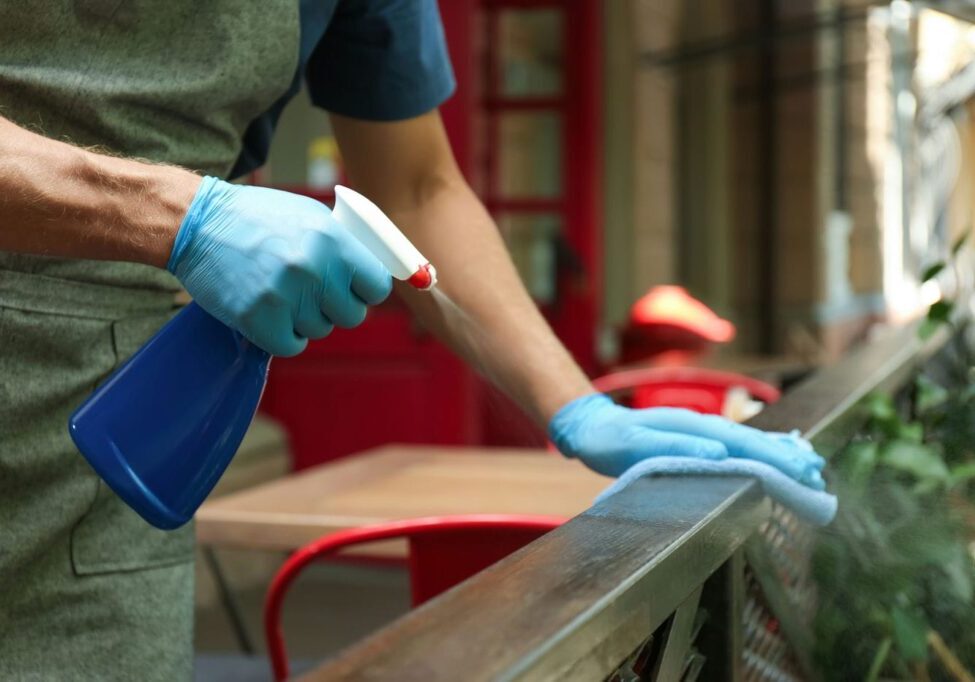 man cleaning his aluminum railings